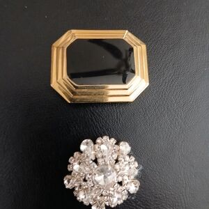 Elegant Gold and Black Brooch